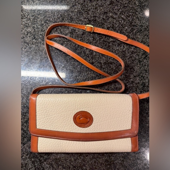 Dooney & Bourke Handbags - Dooney & Bourke Bone and Tan Leather all weather checkbook organizer. Vintage